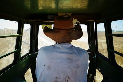 Rear view of man in train