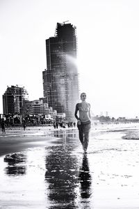 Full length of woman standing in water