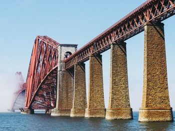 Bridge over sea against sky