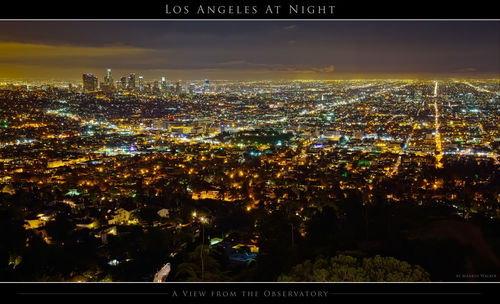 Illuminated cityscape against sky at night