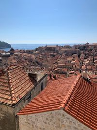 High angle view of townscape against clear blue sky