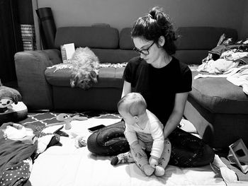 Girl sitting on sofa at home