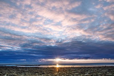 Scenic view of sea against sky at sunset