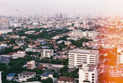 High angle view of buildings in city against sky