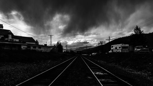 Train on railroad tracks against sky