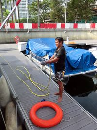 Full length of man standing in bus