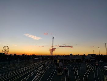 High angle view of railroad tracks against sky during sunset