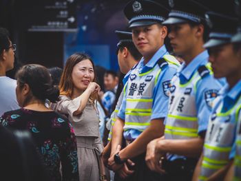 Friends standing on mobile phone