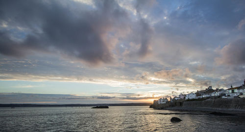 Scenic view of sea against dramatic sky