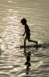 Reflection of woman in water