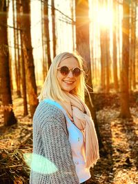 Portrait of a smiling young woman in forest