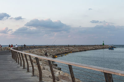 Pier over sea against sky