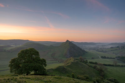 Scenic view of landscape against sky during sunset