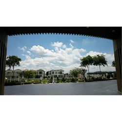 View of buildings against cloudy sky