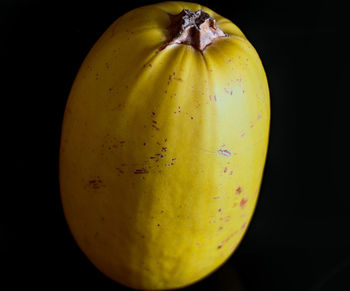 Close-up of apple against black background