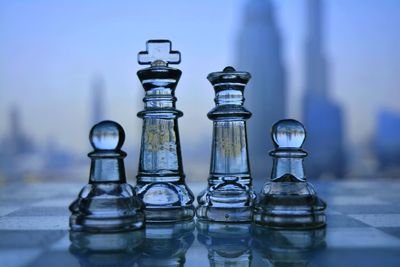 Close-up of chess pieces on table