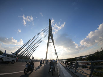 View of bridge in city against sky