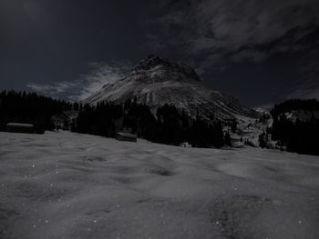 Scenic view of landscape against sky during winter