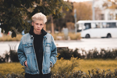 Portrait of young man standing outdoors