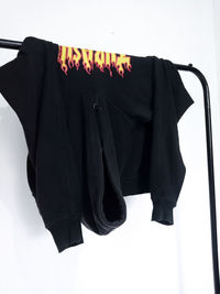 Close-up of clothes drying against black background