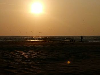 Scenic view of sea against clear sky during sunset