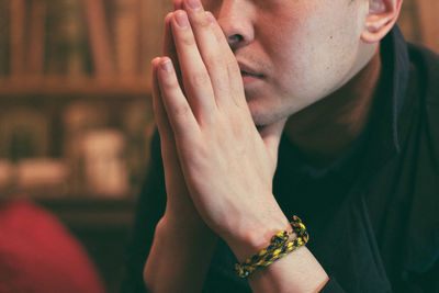 Close-up of man hand sitting at home