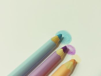 Close-up of colored pencils on paper