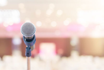 Close-up of microphone in auditorium