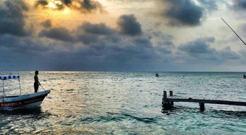 Scenic view of sea against cloudy sky