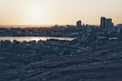 High angle view of buildings against sky during sunset