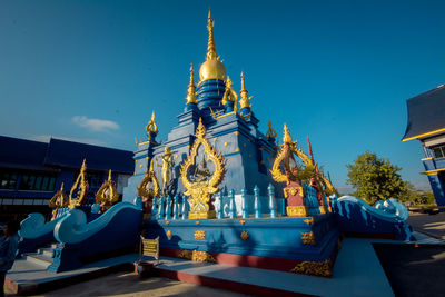 Low angle view of temple against building