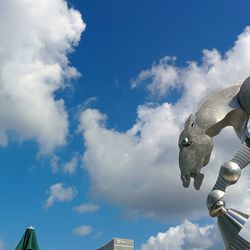 Low angle view of building against cloudy sky