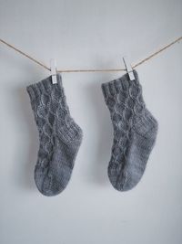 Close-up of clothes drying against white background