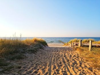 Scenic view of beach against clear sky