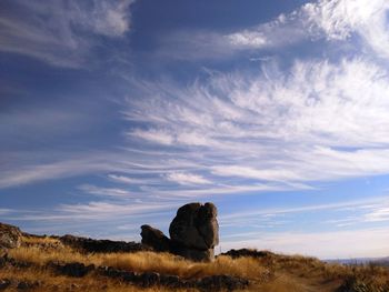 View of rock formation against blue sky