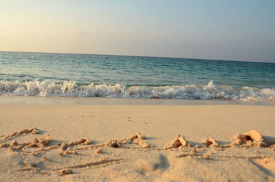 Scenic view of beach against clear sky