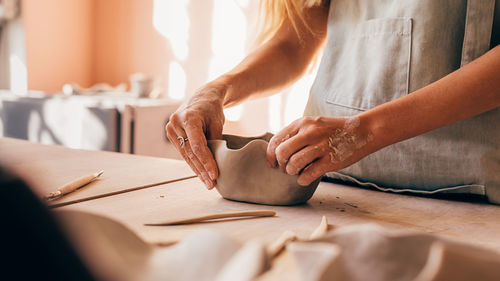 Midsection of woman preparing food