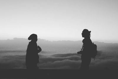 Man standing in foggy weather