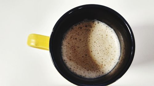 Close-up of coffee cup against white background
