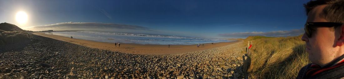 Panoramic view of beach against sky