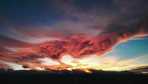 Low angle view of cloudy sky at sunset