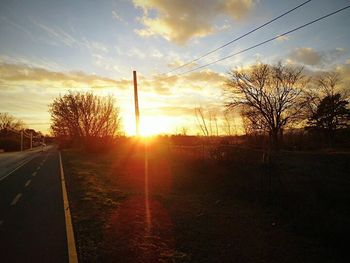 Scenic view of road at sunset