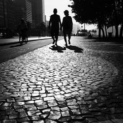 Woman walking on footpath