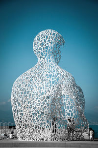 Statue against blue sky