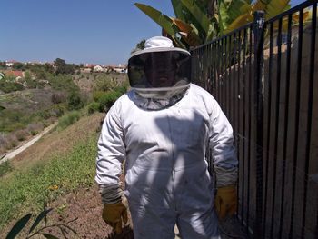 Man wearing protective clothes while standing outdoors