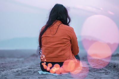 Rear view of woman at beach