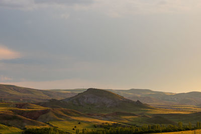 Scenic view of landscape against sky during sunset