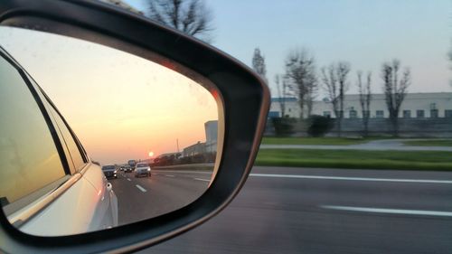 Reflection of sky on side-view mirror