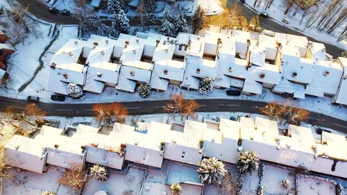 High angle view of text on snow covered city