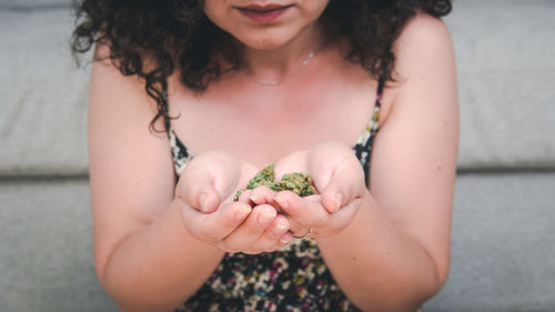 Midsection of woman holding girl